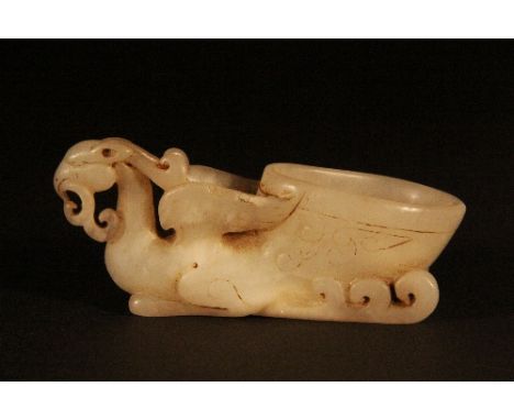 A Chinese white jade phoenix handle libation cup L 9cm