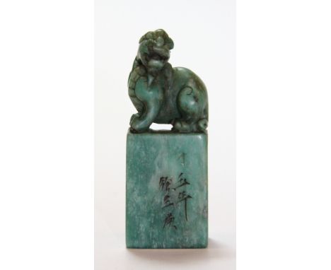 An early 20thC Chinese green soapstone seal mounted with a young dragon H 8cm