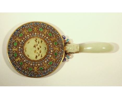 A lovely Chinese gilt silver and enamel hand mirror inset with apple green and white jade and with a jade dragon buckle handl