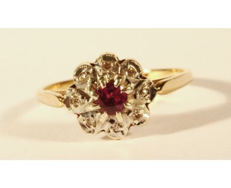 A 9ct gold ruby and diamond cluster ring (O.5)