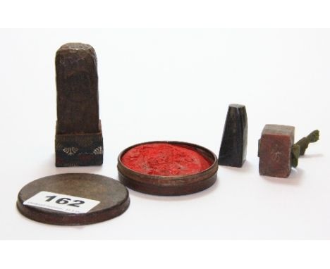 A Chinese soapstone seal, wooden seal with box base, horn seal and early 20th century tin of seal ink