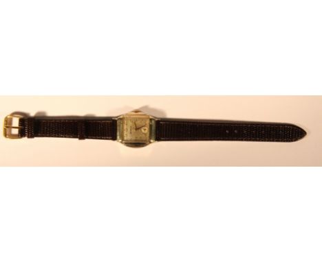 A gents vintage gold plated Benrus wristwatch on a leather strap