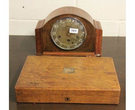 A chiming mantle clock and an oak case cutlery set