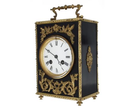 French two train mantel clock striking on a bell, the 3.5" white dial within an ebonised case with gilt foliate mounts, surmo