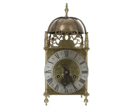 Contemporary brass two train lantern clock, the 5.75" silvered chapter ring enclosing a foliate engraved centre, surmounted b