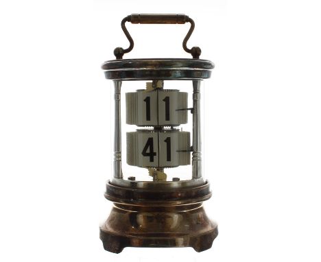Silver plated ticket clock, within a cylindrical glazed case with fixed key wind beneath and surmounted by a carrying handle,