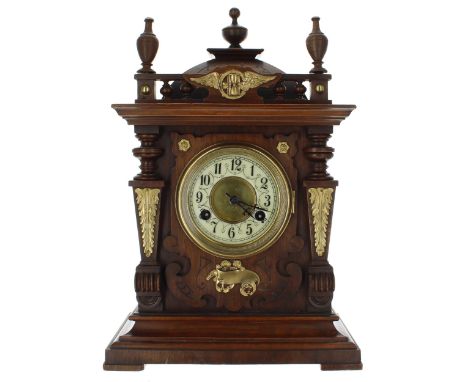 German walnut two train mantel clock striking on a gong, the 3.75" dial enclosing a recessed gilt centre, within an architect
