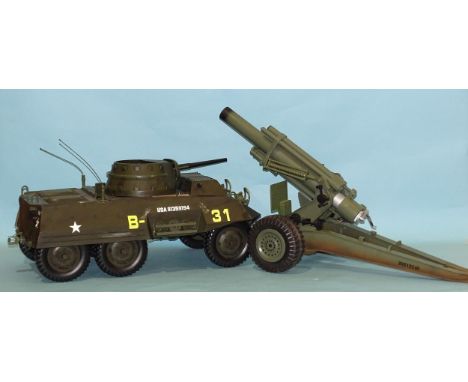 A Hasbro US four-seater armoured car, a 1/6th-scale field gun and another armoured car, (3). 