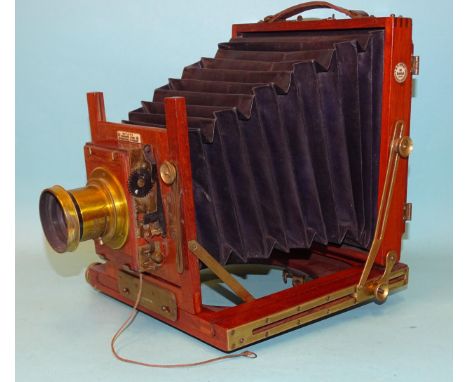 A mahogany and brass half-plate bellows camera "The Popular", B.T. Bayley, 8 Union Street, Stonehouse, with brass lens and ro