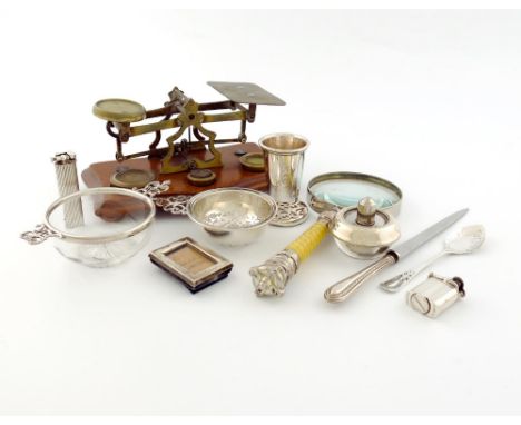 A mixed lot of silver items, various dates and makers, comprising: a tea strainer, a silver-mounted glass bonbon dish, a mini