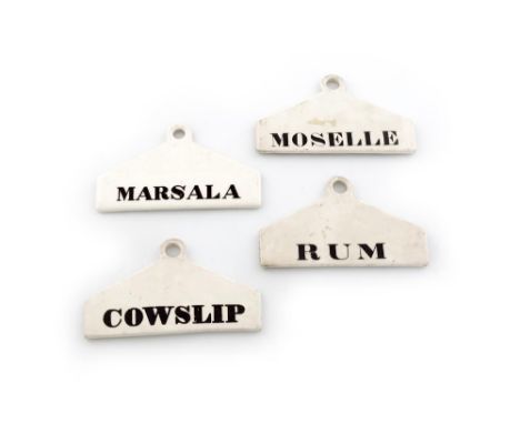 A collection of four ceramic bin labels, one stamped MINTON, tapering rectangular form, titles, 'COWSLIP', 'MARSALA', 'MOSELL