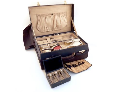 A silver-mounted travelling dressing table set, by Walker and Hall, London and Sheffield various dates including 1924 and 193