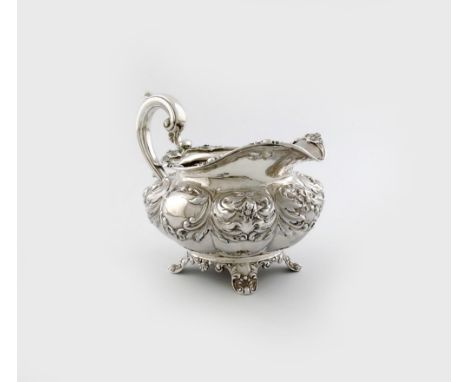An early Victorian silver cream jug, by Joseph and John Angell, London 1837, lobed circular form, scroll handle, foliate bord