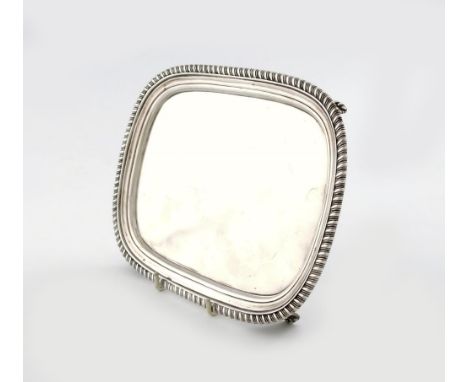 A George III silver salver, possibly by William Bennett, London 1813, rectangular form, gadroon border, on four four bracket 