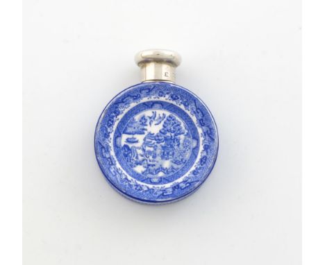 A Victorian silver mounted ceramic scent bottle, by S. Mordan, London 1887, circular form, with blue Willow pattern decoratio