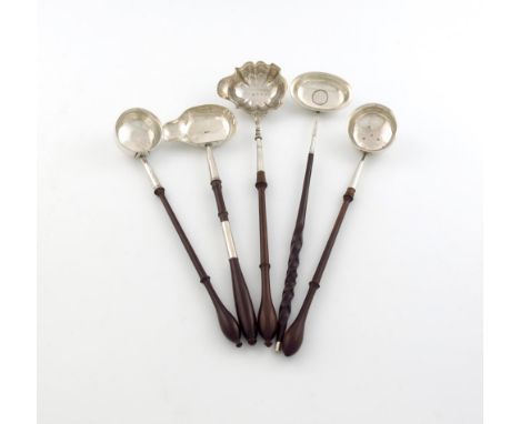 A collection of silver toddy ladles, comprising: a George III silver punch ladle, by Thomas Shepherd, London 1782, circular f