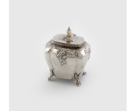 ?A late Victorian silver tea caddy, by, Birmingham 1896, bombe form, with embossed decoration, on four scroll feet, hinged co