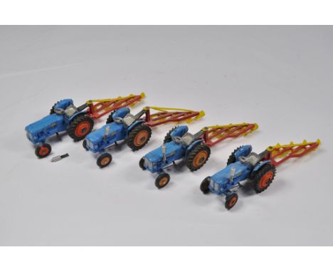 Fine selection of Corgi Toys Fordson Power Major Tractor Models with ploughs. In need of a clean but otherwise generally NM, 