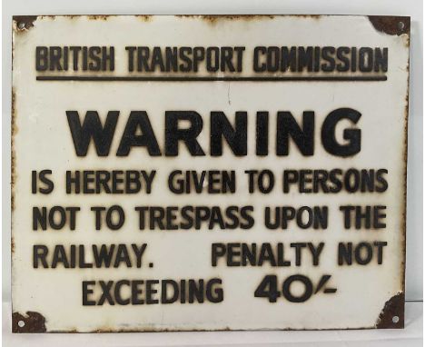 An enamel British Transport Commission trespass warning sign, 15" x 12"