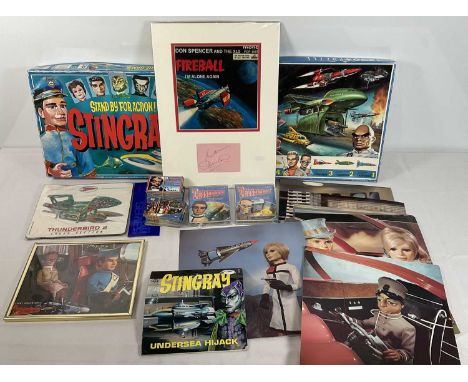 A collection of Gerry Anderson memorabilia including Stingray The Game, A Thunderbirds puzzle, a print mounted with Don Spenc