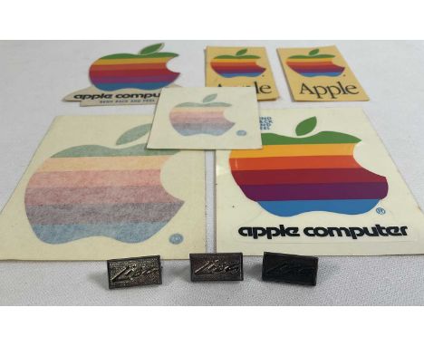 APPLE COMPUTERS - A group of Apple collectibles to include 3 1980s Apple 'Lisa' silver metal pin badges and 6 1980s rainbow A