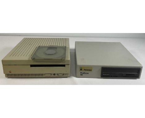 APPLE COMPUTERS - A 1988 Apple CD SC external CD-ROM drive with disk caddy, rainbow Apple logo, volume control, and headphone