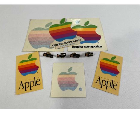 APPLE COMPUTERS - A group of Apple collectibles and memorabilia to include 4 rainbow Apple 'Lisa' enamel lapel pin badges, an