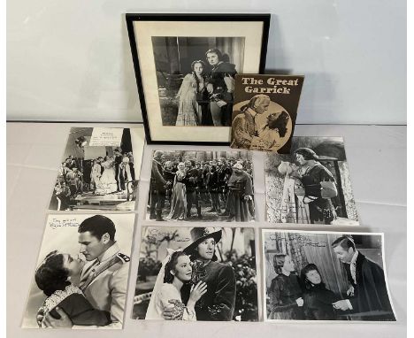 A group of 9 autographed promotional stills signed by OLIVIA DE HAVILLAND from the movies THE ADVENTURES OF ROBIN HOOD (1938)