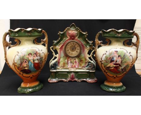 A Victorian pottery clock garniture comprising large mantle clock with transfer decoration and matching vase side pieces. Clo