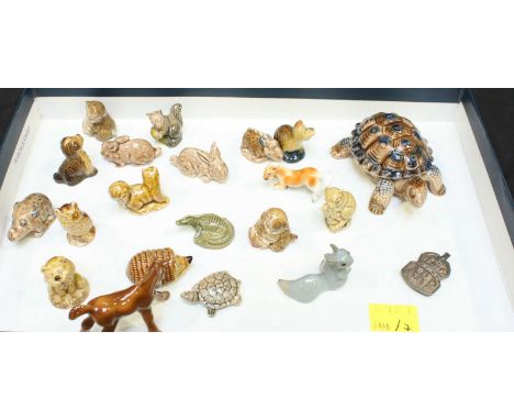A collection of Wade animals and a small silver WW2 ARP badge.