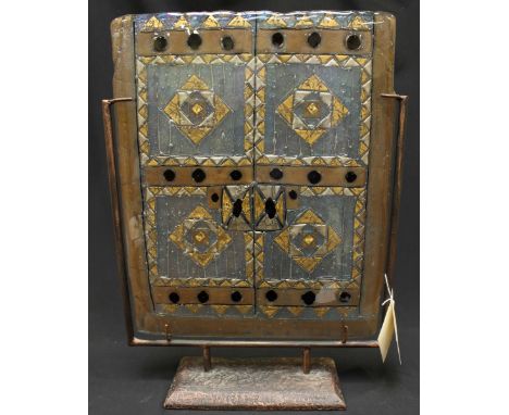 An Italian Giuse Maggi iridescent and coloured glass fire screen on a wrought iron stand.