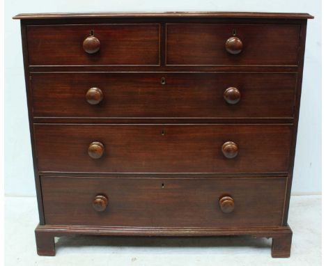 A 19th century mahogany chest of two short and three long graduated drawers, with original cock-beading and turned pulls, on 
