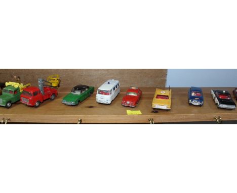 A shelf of assorted die cast toy cars and military vehicles by Corgi, Dinky, Benbos and others, all without boxes.