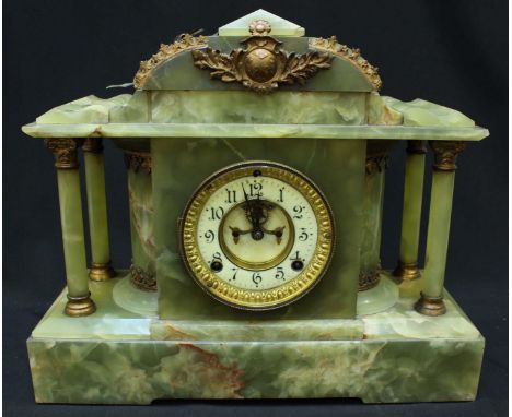 A large Victorian onyx mantle clock, with American Ansonia movement, white enamel dial and column sides.