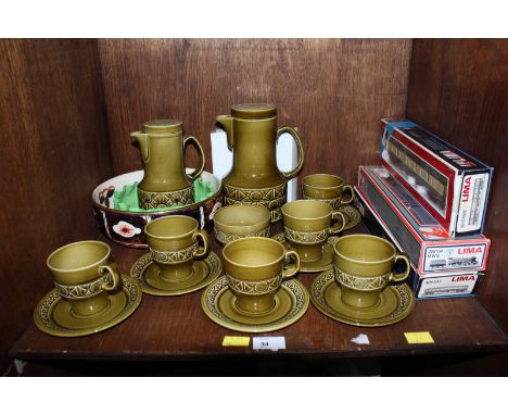 SECTION 34. A Beswick coffee service, together with two ceramic bowls and a Lima locomotive with two carriages.