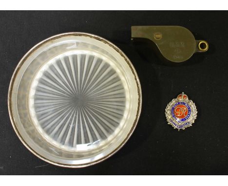 An HMS Hood silver plated butter dish with glass liner and enamel badge, together with a US Army whistle, and a silver and en