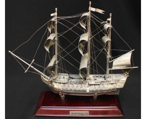 A continental silver scale model of HMS Victory, on stained-wood stand, 25cm high x 30cm in length