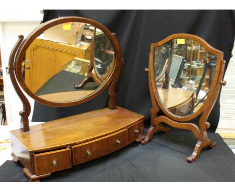 A mahogany bow-front platform mirror, the oval mirror above three frieze drawers and raised on shaped bracket feet, together 