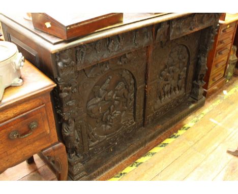 19th century continental carved oak sideboard, with two frieze drawers above a pair of arched panel doors, enclosing a shelf,