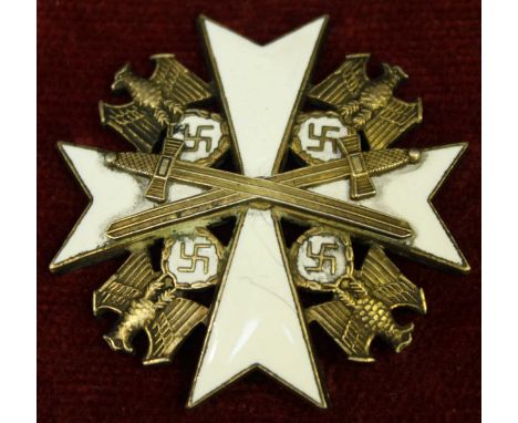 A WWII German Third Reich Order of the German Eagle, 4th class with crossed swords, of brass and white enamel, with central c
