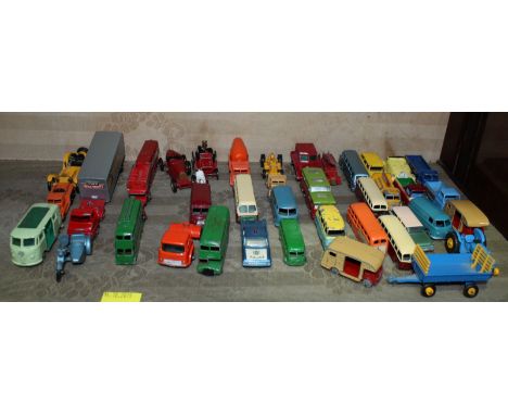 A shelf of assorted Lesney Matchbox die cast toy buses and other vehicles, all without boxes.