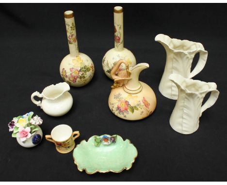 A collection of Royal Worcester including a blush ivory jug painted with flowers and pair of ivory ground bottle vases decora