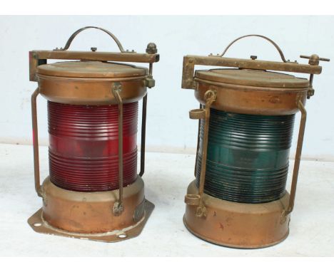 A pair of early 20th century ships copper 'all round light' port and starboard lamps, stamped 'IP 56'. 34 cm high.