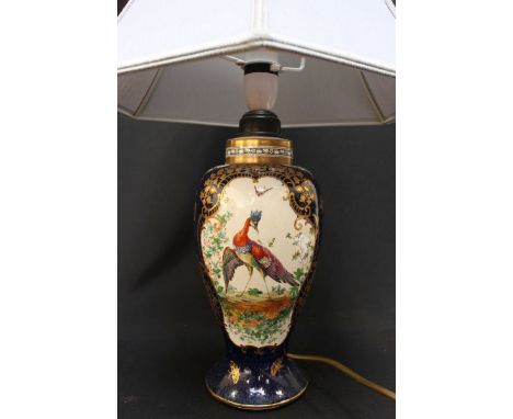 A large Booths bird of paradise table lamp, painted with exotically coloured birds on a blue and gilt ground, the base with f