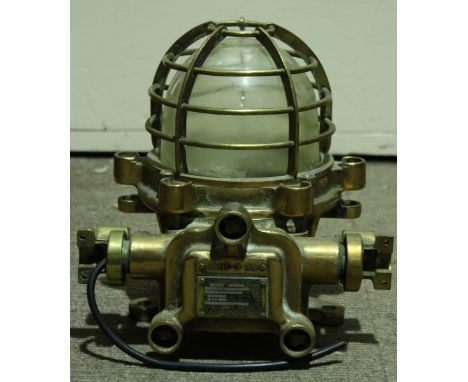 An American ships brass 'Explosion Proof Ceiling Lamp', with brass cage around the light, made by Morio Denki Co Ltd.