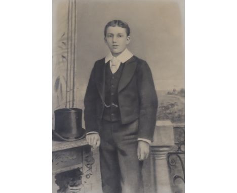 Early 20th century English School, charcoal, Three-quarter length portrait of a young boy, indistinctly signed lower right, 1