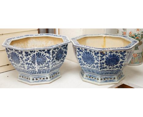 A pair of Chinese octagonal blue and white planters, 37.5cm wide One formerly broken into three large sections and crudely pu
