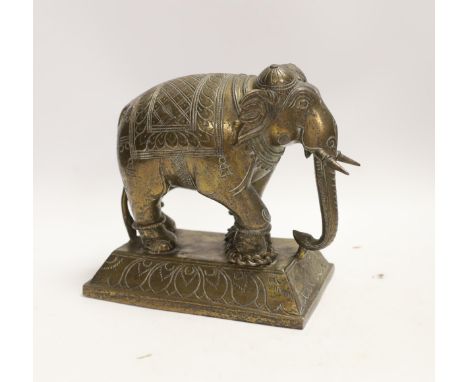 An Indian bronze model of an elephant, 18cm Structurally good; wear to lacquered finish.  18cm high; plinth 18x10.5cm.  Weigh