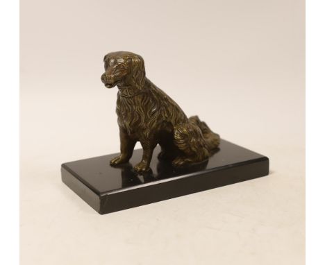 A novelty bronze dog card holder, with articulated jaw, base 14.5cm wide