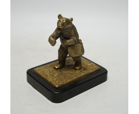 A novelty bronze bear paperweight on stand, 12.5cm high